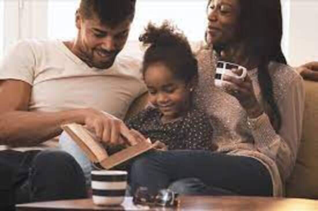 Father reading Bible to child