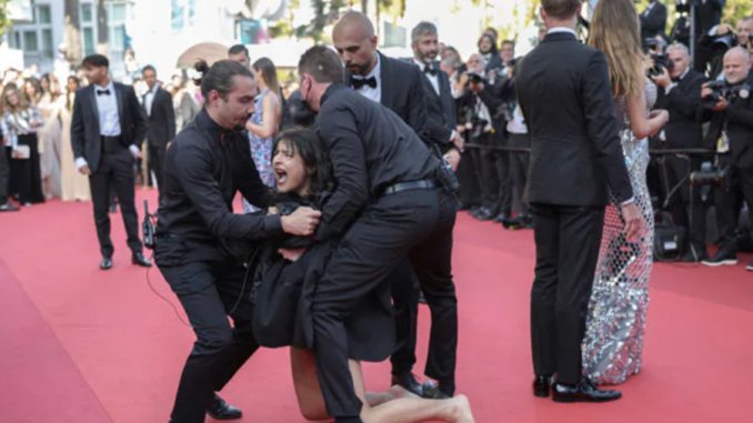 Topless woman protests at Cannes Film Festival