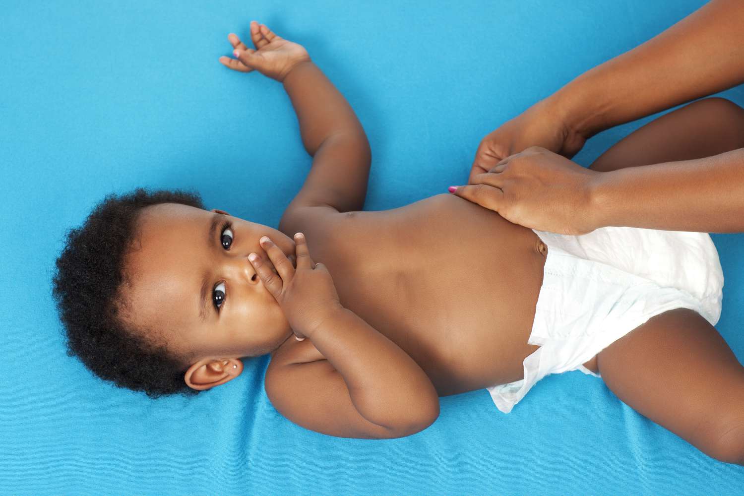 A baby getting his diaper changed