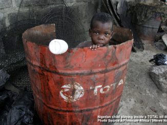 Nigerian Child, Doyin Ajala plays inside a Total oil drum at the waterfront in Lagos, Nigeria Friday, Oct. 17, 2008 Photo by AP Photo/Sunday Alamba /Source — Signal NG/ Ventura