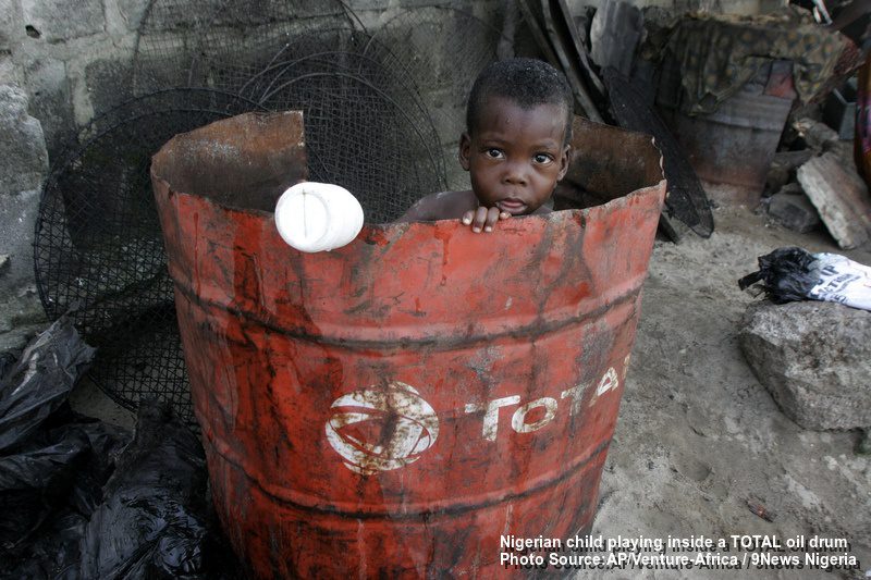 Nigerian Child, Doyin Ajala plays inside a Total oil drum at the waterfront in Lagos, Nigeria Friday, Oct. 17, 2008 Photo by AP Photo/Sunday Alamba /Source — Signal NG/ Ventura