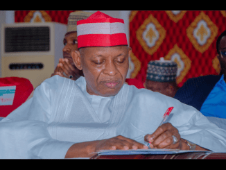 Governor Abba Yusuf signing a doument 1