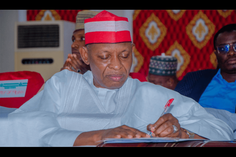 Governor Abba Yusuf signing a doument 1