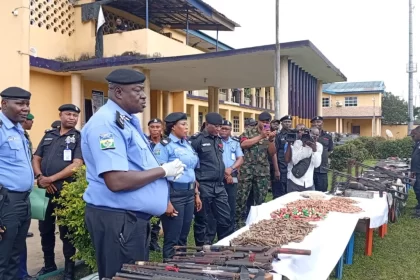 Commissioner of Police in Rivers CP Olugbenga Adepoju presenting cache of arms to journalists in Port Harcourt on Thursday
